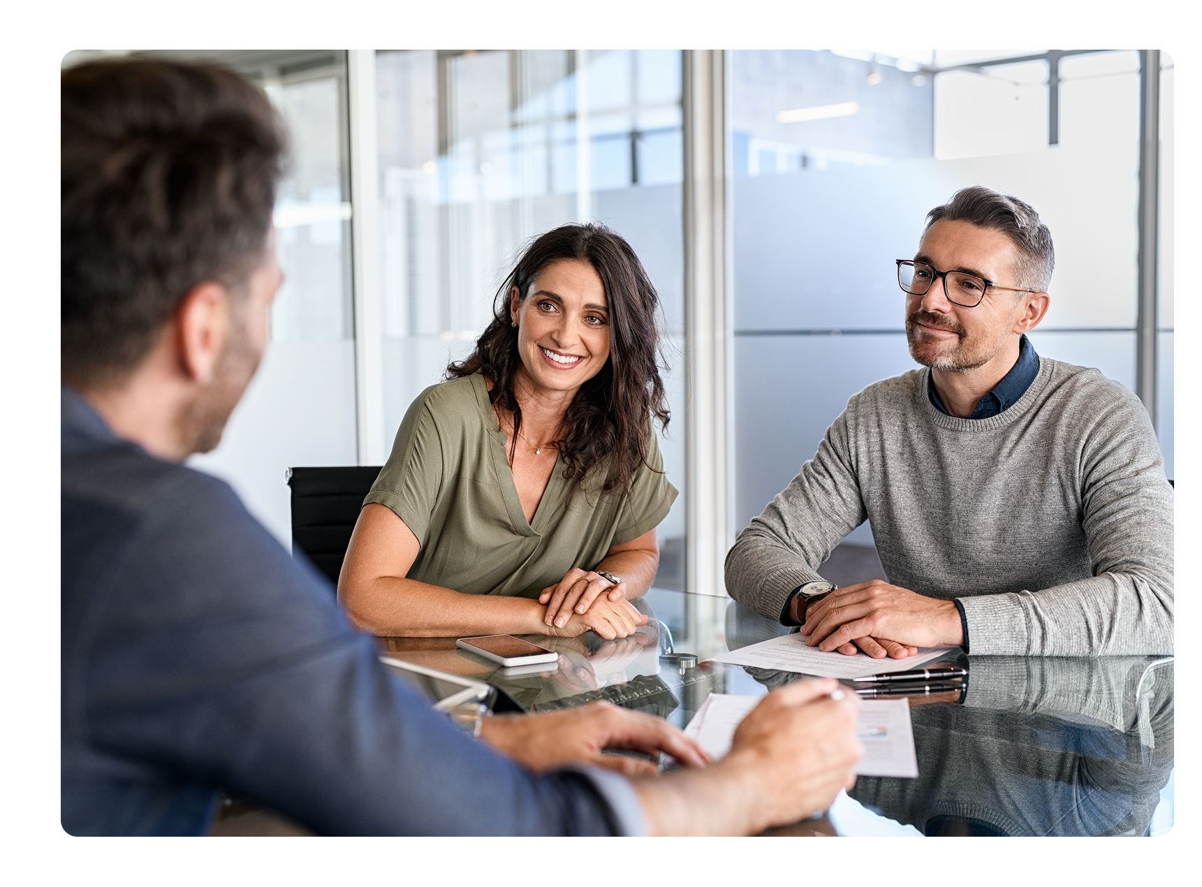 three people meeting in a conference room