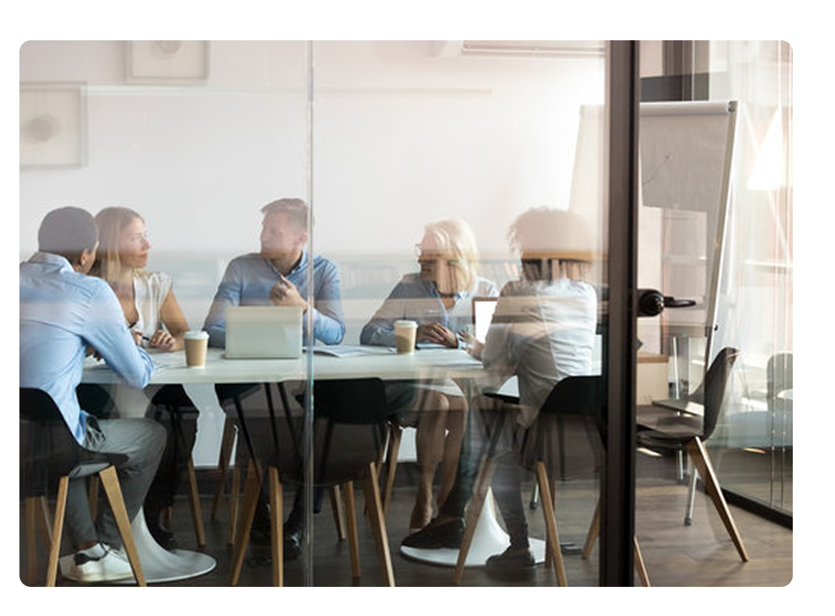 Multiple employees meeting in a conference room