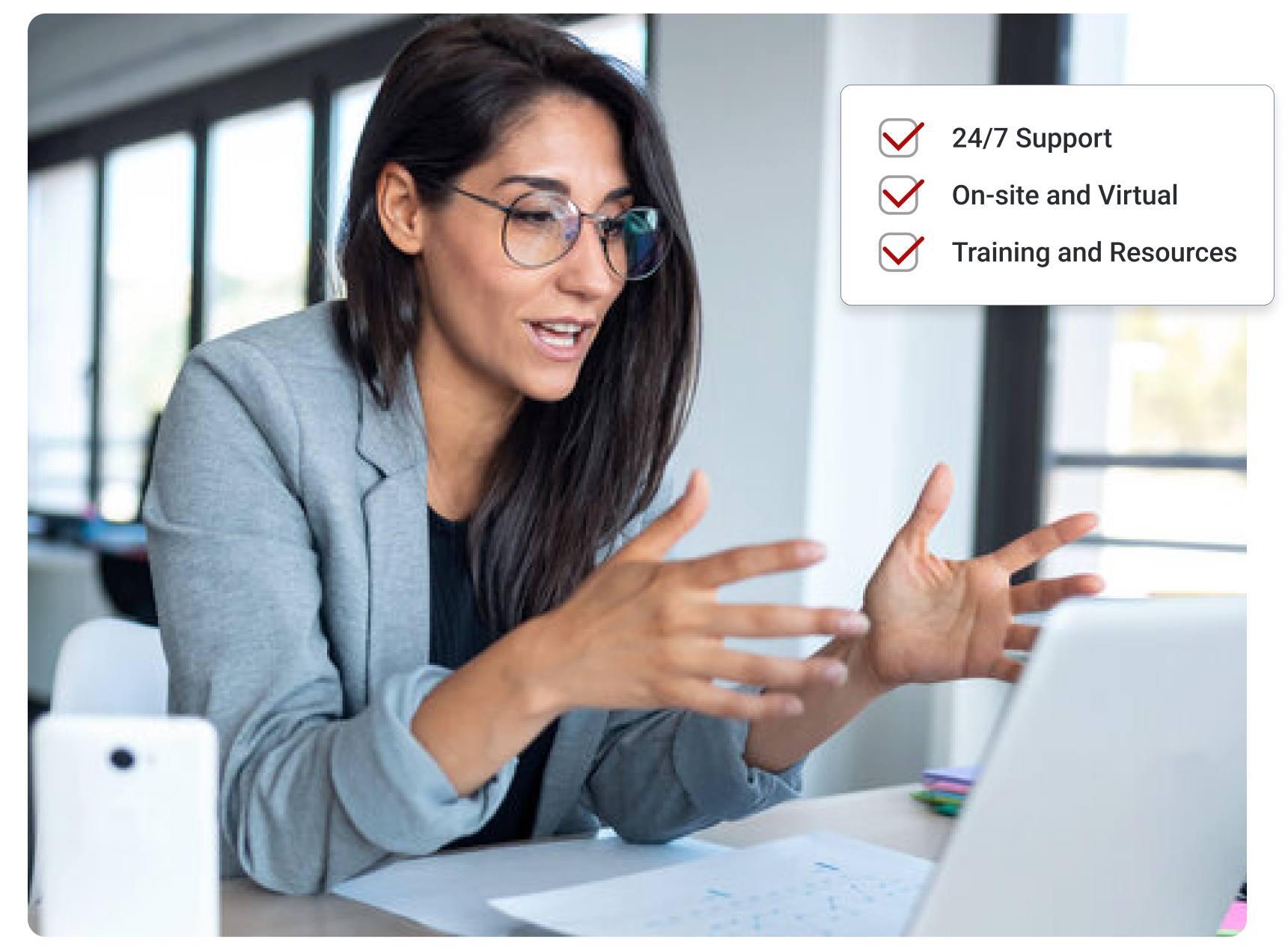 Woman looking at laptop consulting with a client