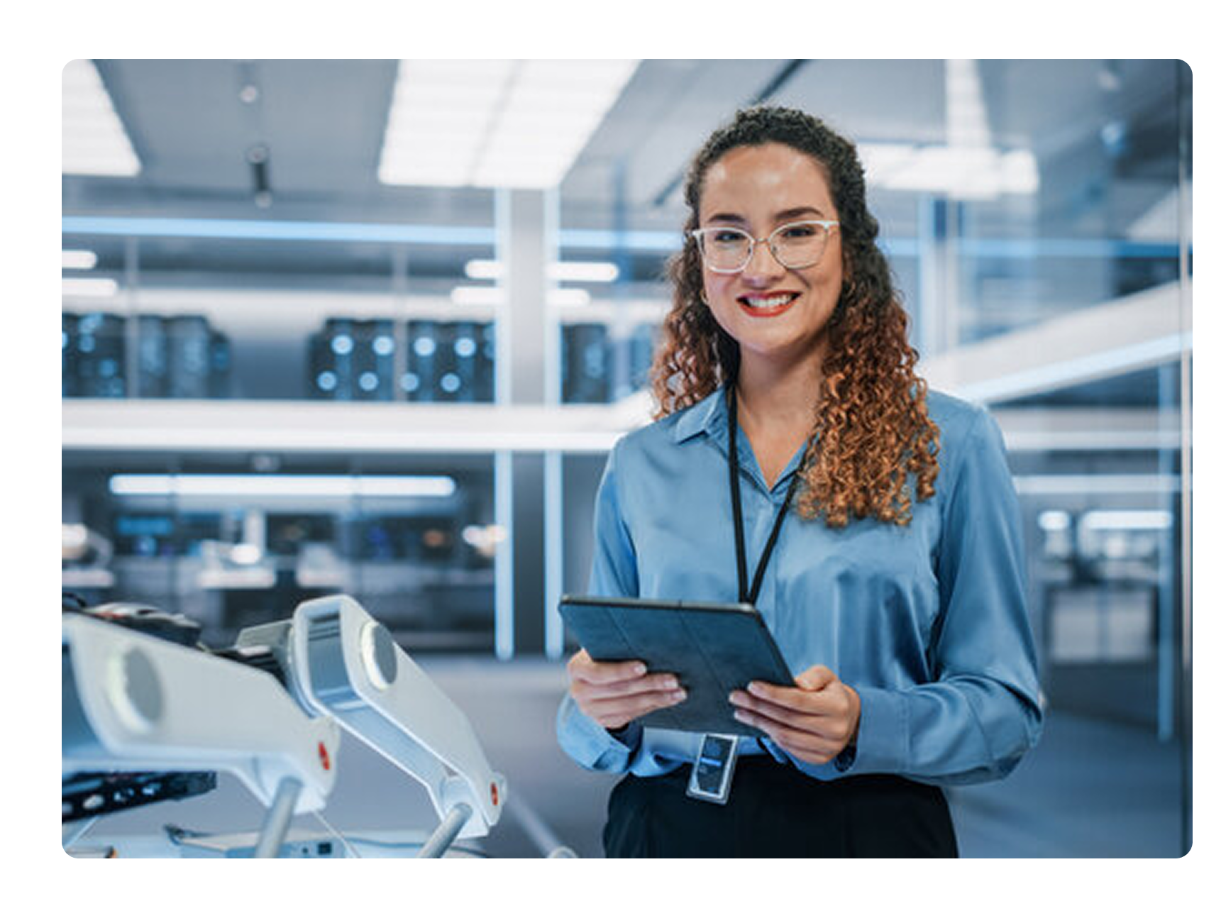 female engineer holding a tablet smiling