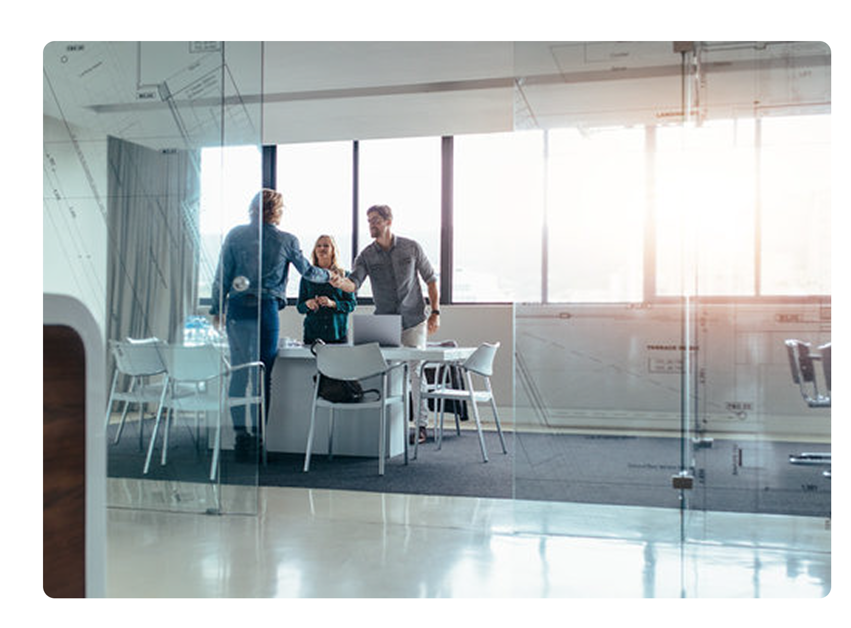 Sychrono customer service team meeting with manufacturing client