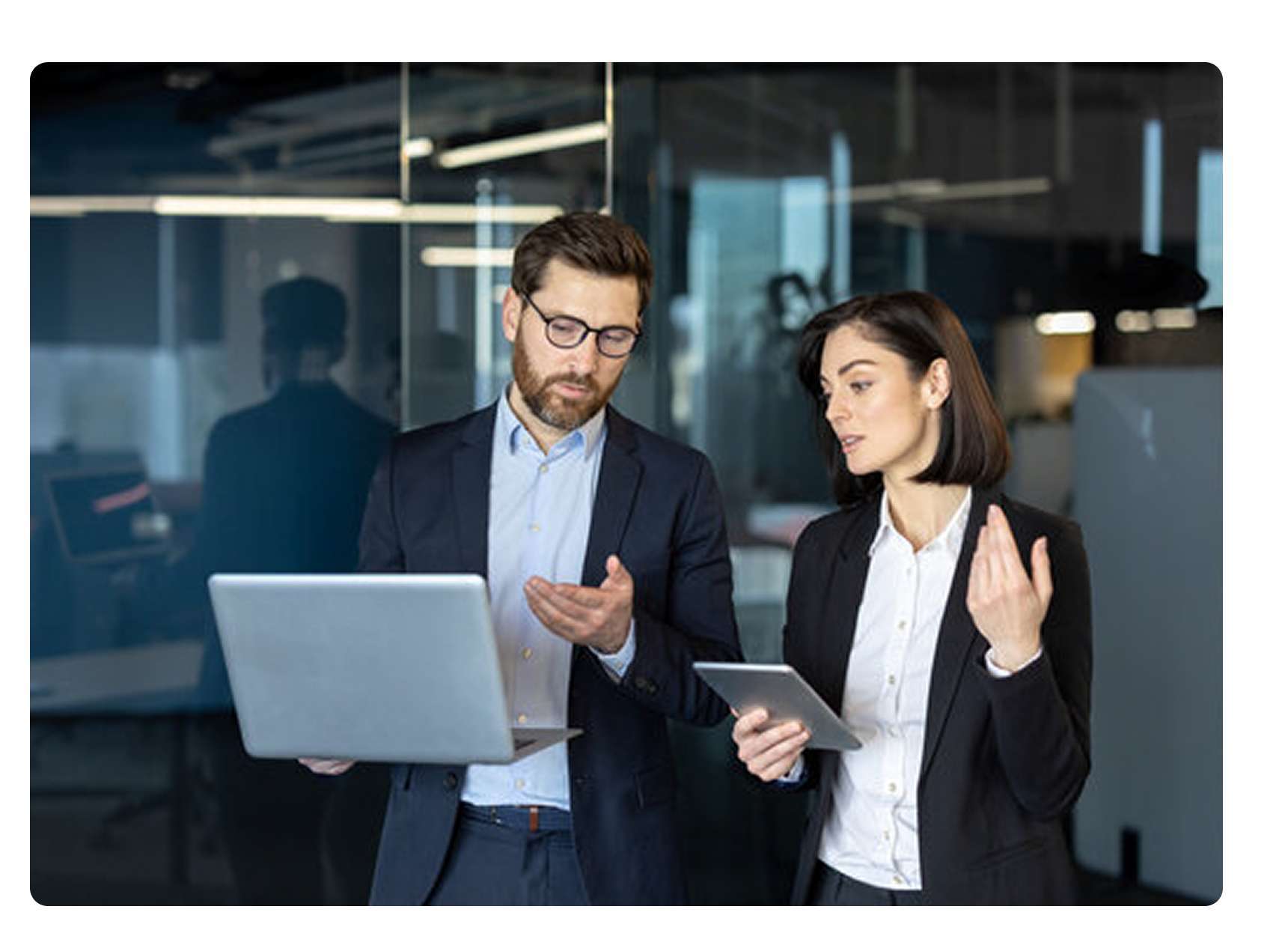 Two people talking through strategy