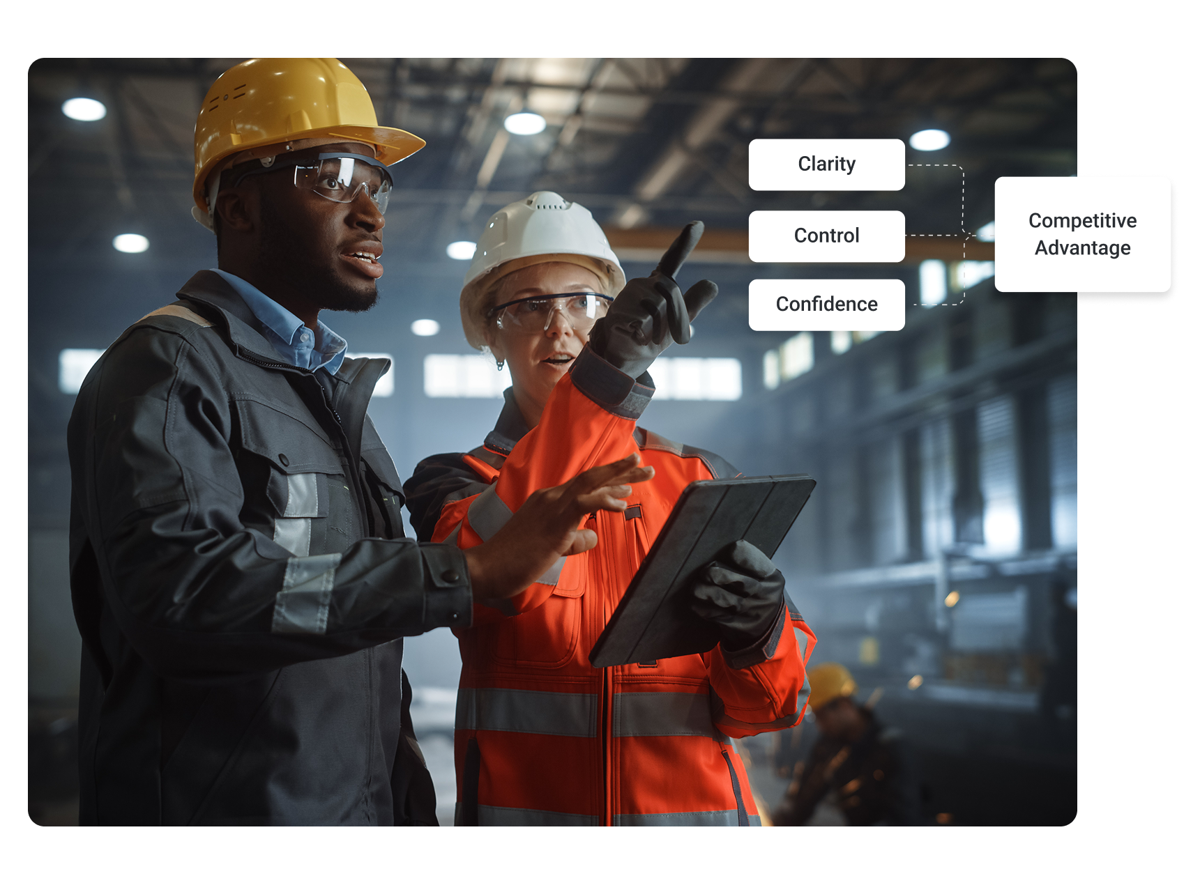 a man and woman in a manufacturing plan pointing and looking at something